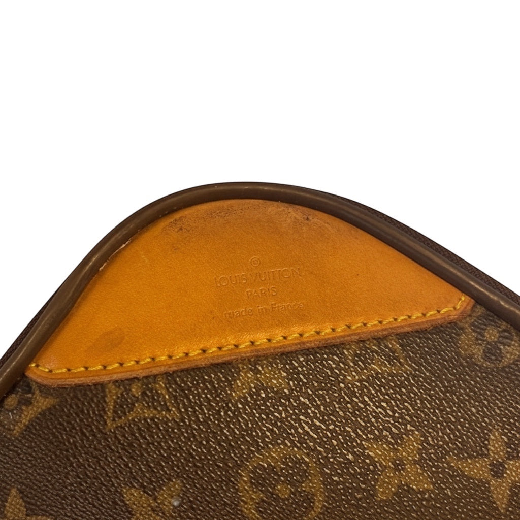 Posh Purse Co. Louis Vuitton Monogram Pegase 60 rolling suitcase detail with leather trim and embossed logo.