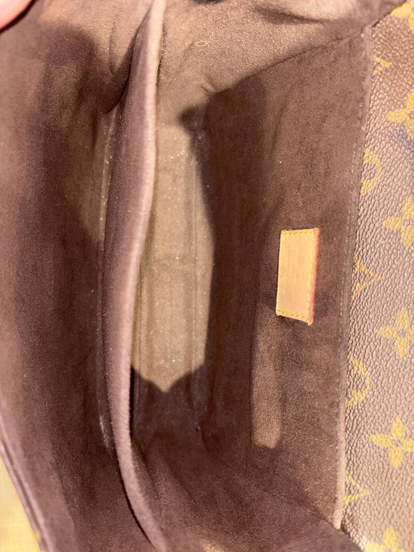 Posh Purse Co Louis Vuitton Monogram Pochette Metis interior with brown suede lining and compartments.
