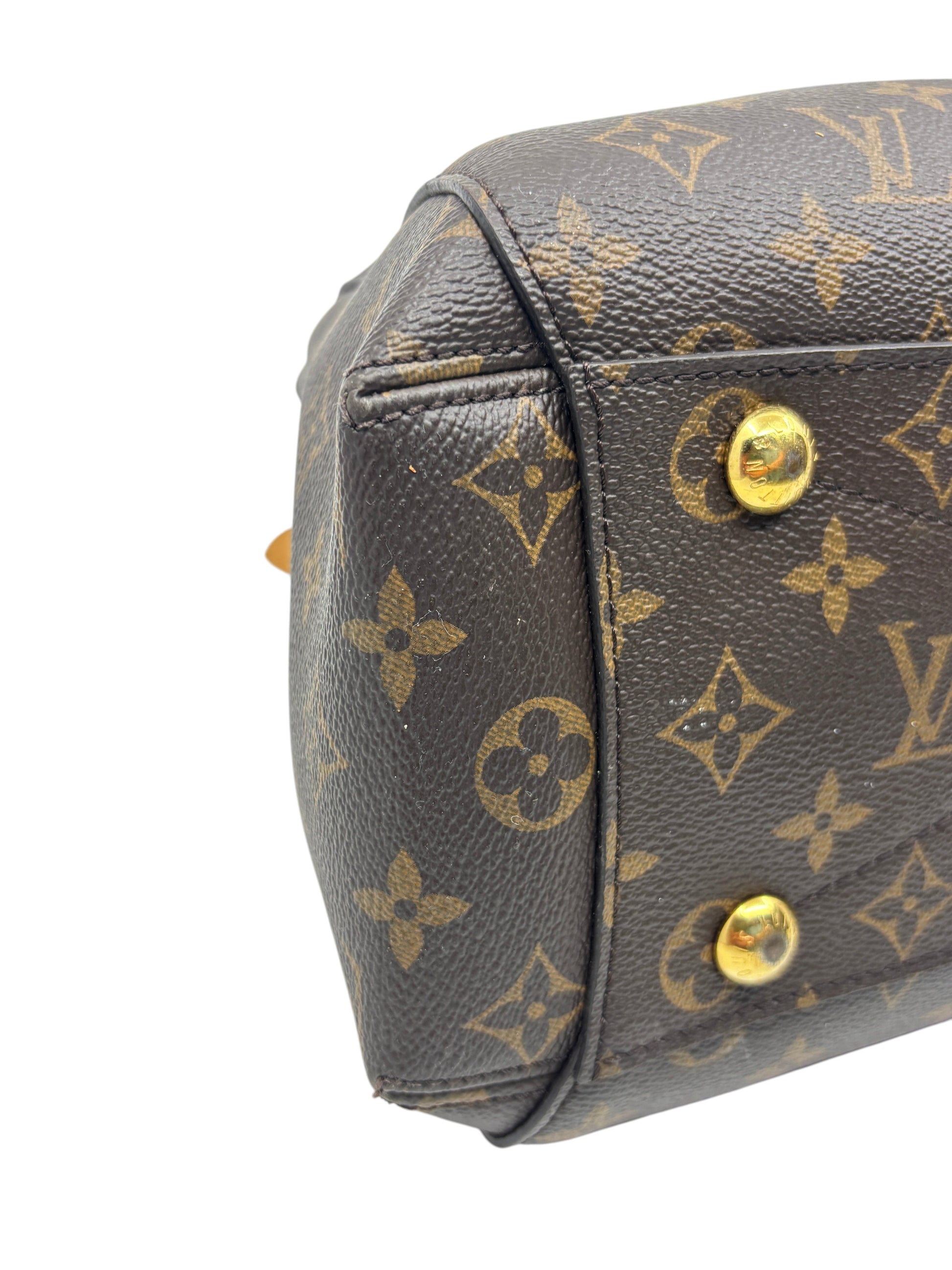 Posh Purse Co. Louis Vuitton Montaigne MM monogram canvas handbag showing base corner detail and gold-tone feet