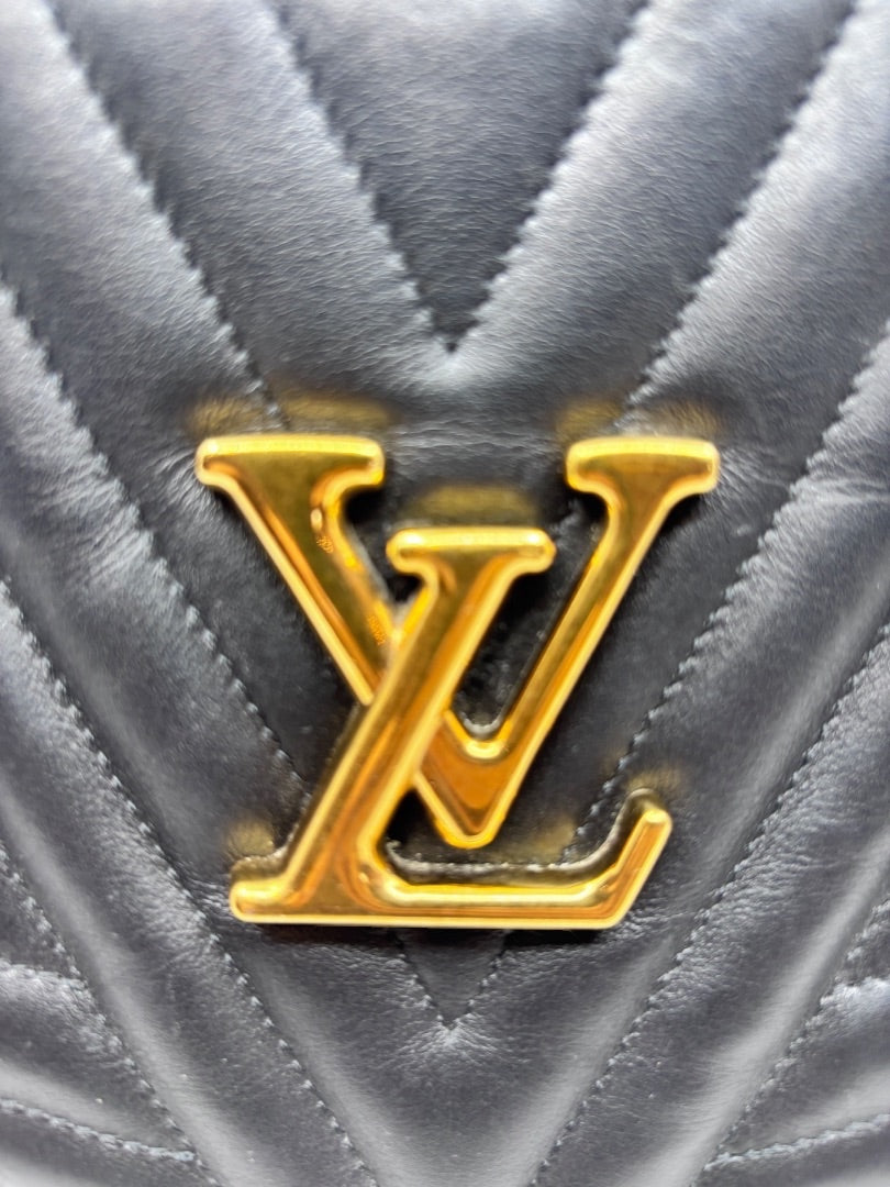 Posh Purse Co black quilted leather Louis Vuitton New Wave bag featuring a polished gold LV logo hardware detail