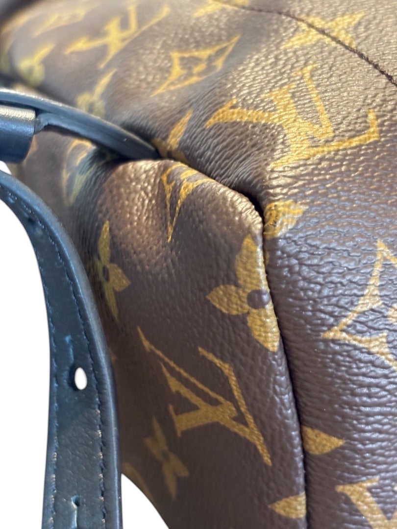 Posh Purse Co Louis Vuitton Palm Springs Monogram coated canvas backpack with adjustable leather straps and gold-tone hardware.