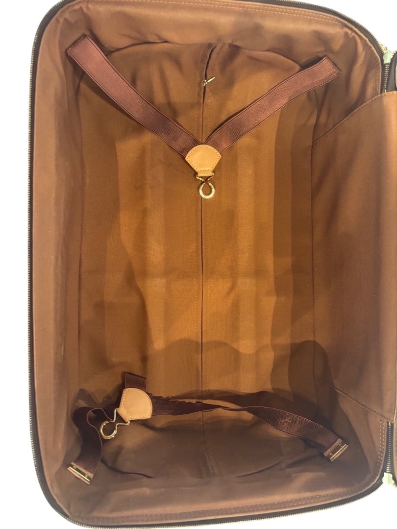 Interior of Posh Purse Co. Louis Vuitton Monogram Pegase 60 suitcase with brown lining, garment straps, and leather details.