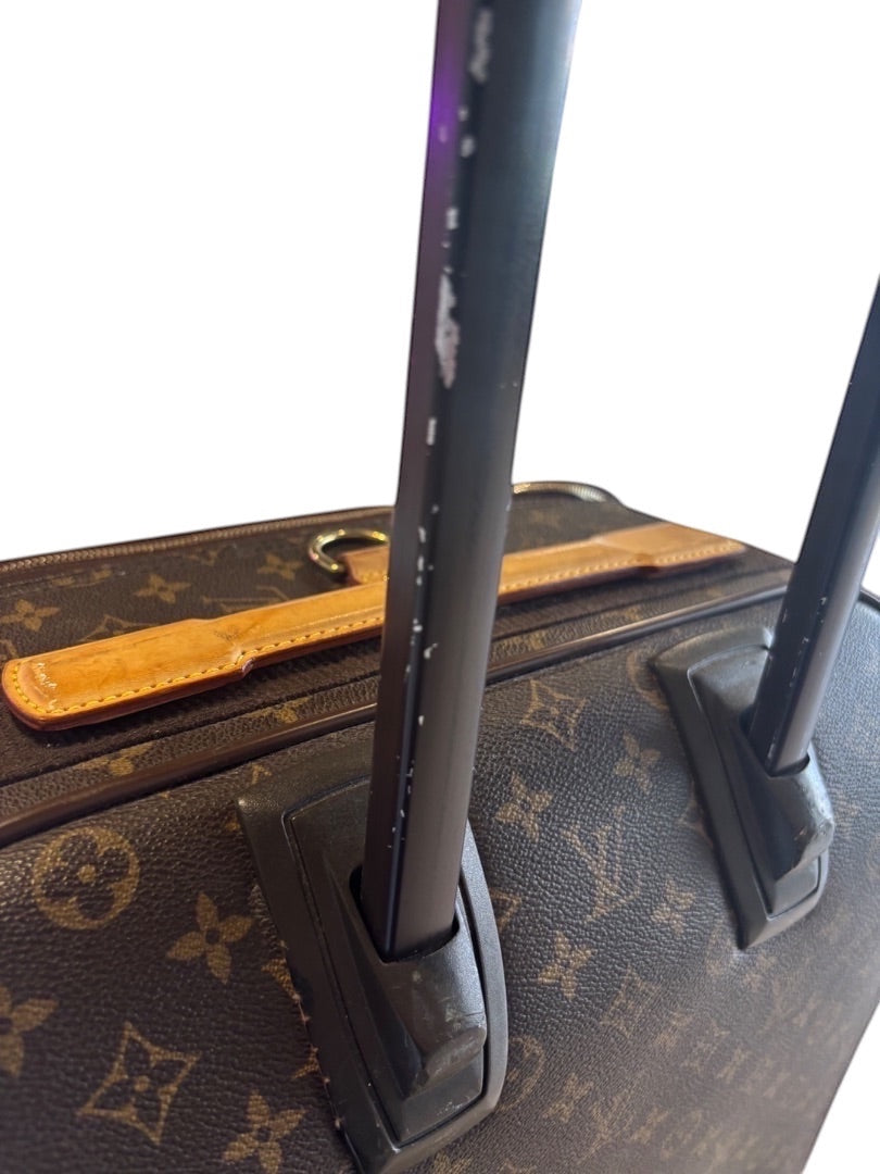 Posh Purse Co. Louis Vuitton Monogram Pegase 60 rolling suitcase with telescopic handle and leather trim. Shows signs of wear.