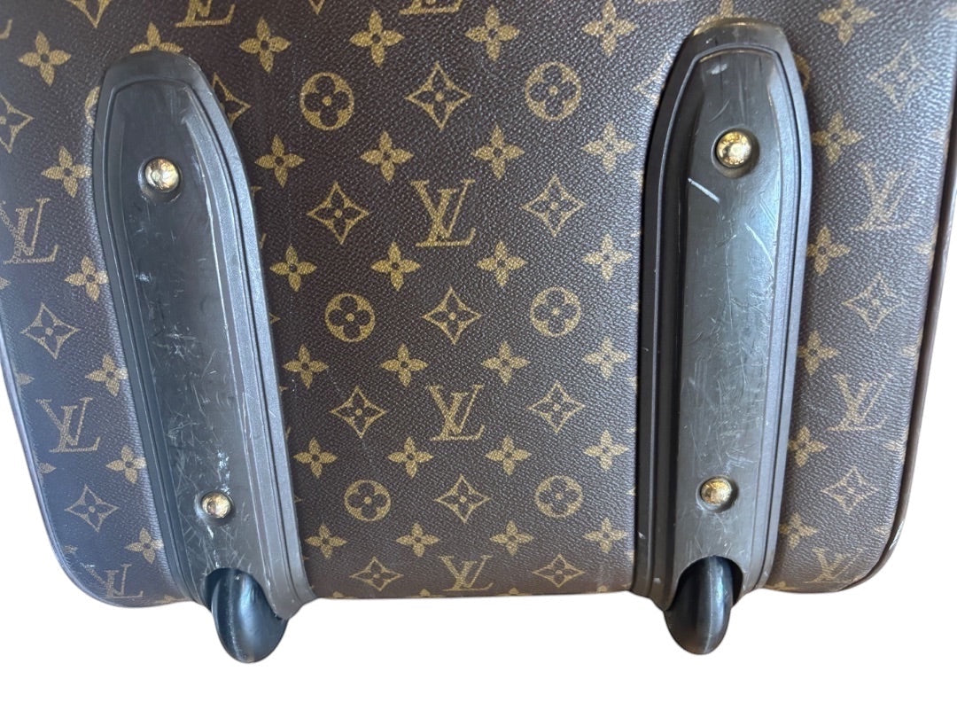 Posh Purse Co. Louis Vuitton Monogram Pegase 60 rolling suitcase with brown LV monogram canvas and black trim.