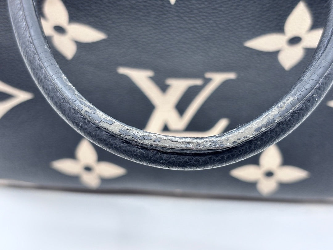 Posh Purse Co preloved Louis Vuitton Petit Palais handbag showing wear on the black leather top handle