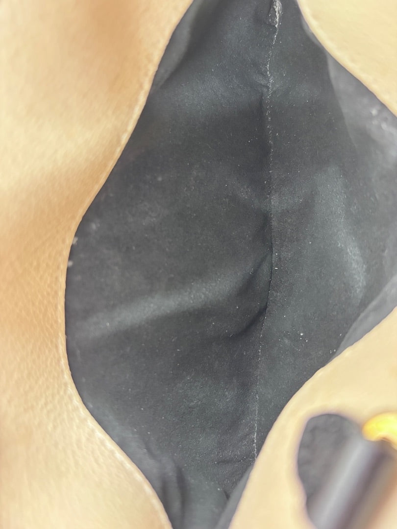 Interior lining of a Posh Purse Co preloved Louis Vuitton Petit Palais handbag showing black fabric and tan trim