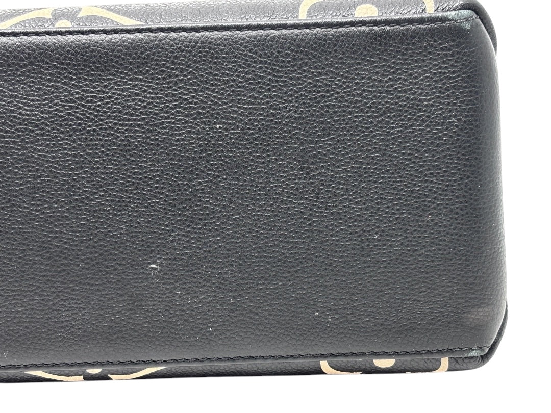 Posh Purse Co Louis Vuitton Petit Palais handbag showing close-up of black leather texture with bicolor monogram