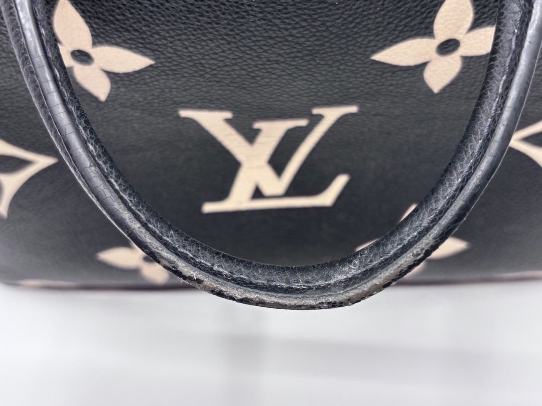 Posh Purse Co preloved Louis Vuitton Petit Palais handbag featuring a black and cream bicolor giant monogram pattern