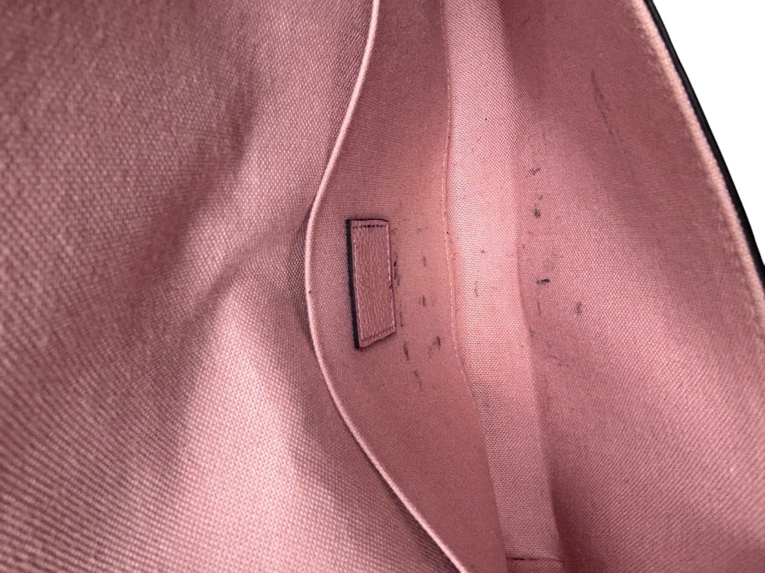 Interior of Posh Purse Co pink Louis Vuitton Pochette Felicie showing textile lining with minor ink stains