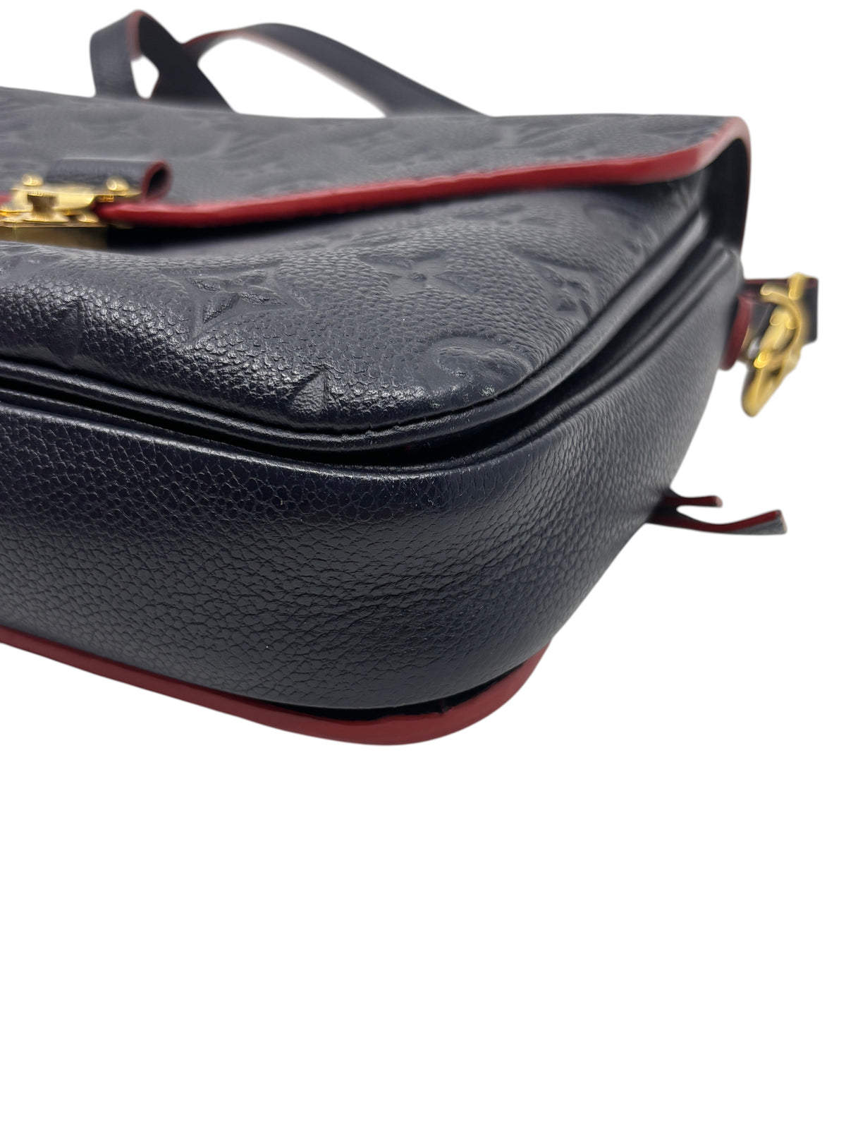 Posh Purse Co. Louis Vuitton Pochette Metis in navy embossed Monogram Empreinte leather with red trim detail