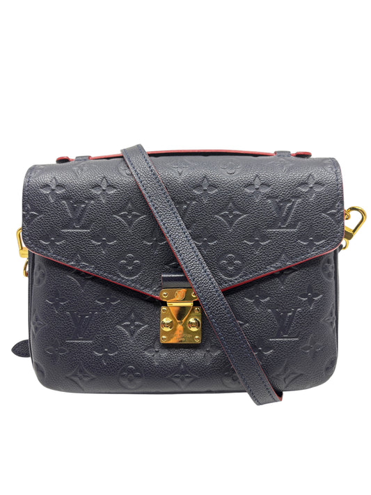 Posh Purse Co. Louis Vuitton Pochette Metis in navy embossed Monogram Empreinte leather with gold-tone S-lock hardware.