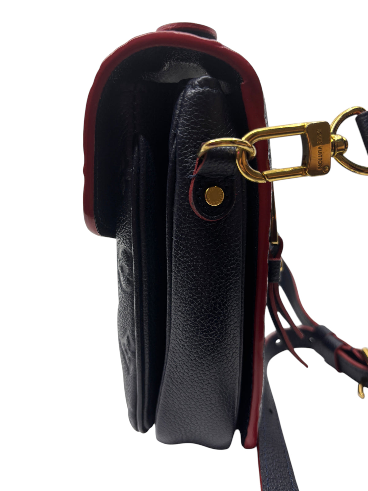 Side view of Posh Purse Co Louis Vuitton Pochette Metis in navy embossed Monogram Empreinte leather with gold hardware