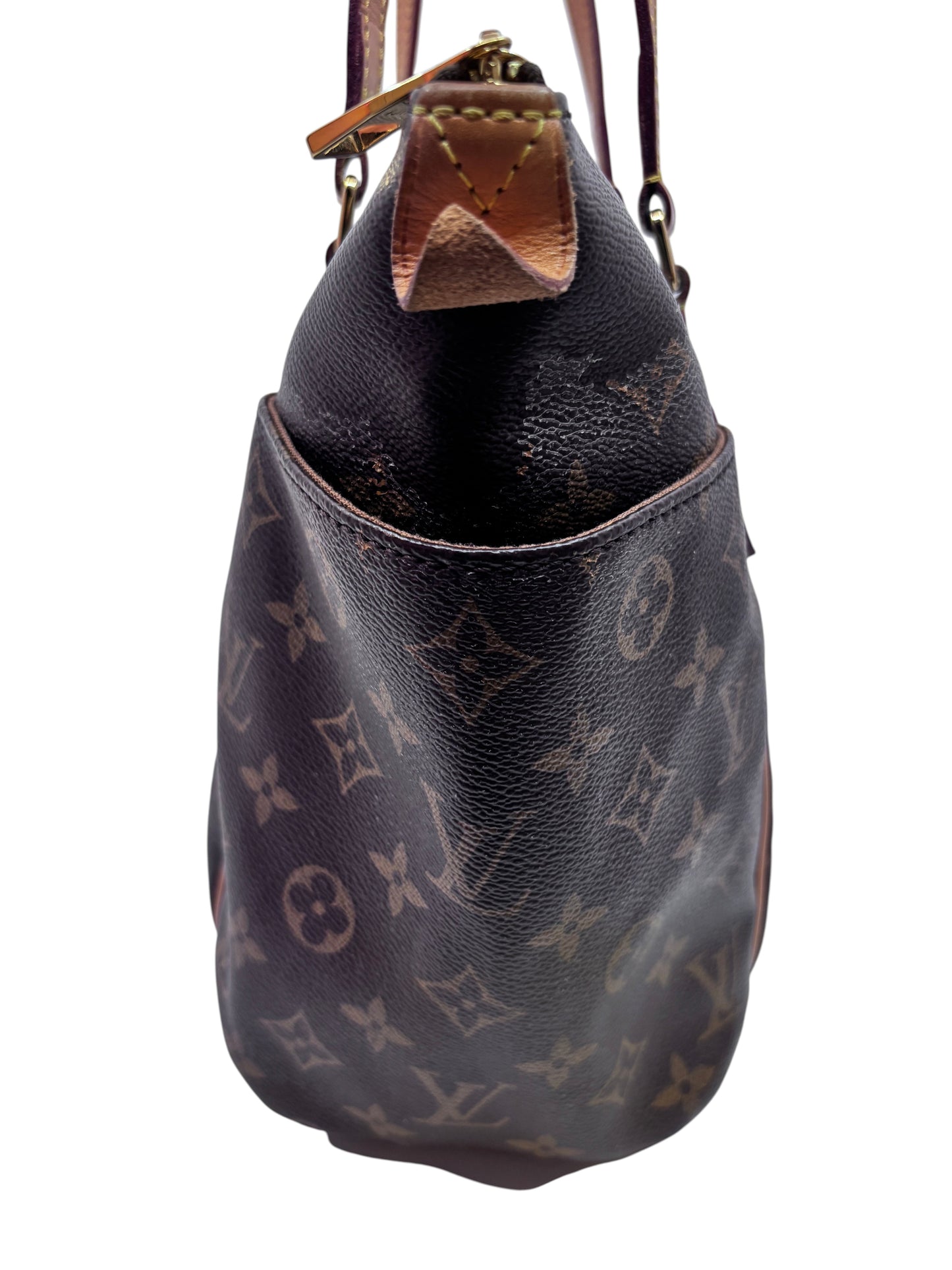 Side view of Posh Purse Co preloved Louis Vuitton Totally PM tote in brown Monogram canvas with Vachetta leather trim
