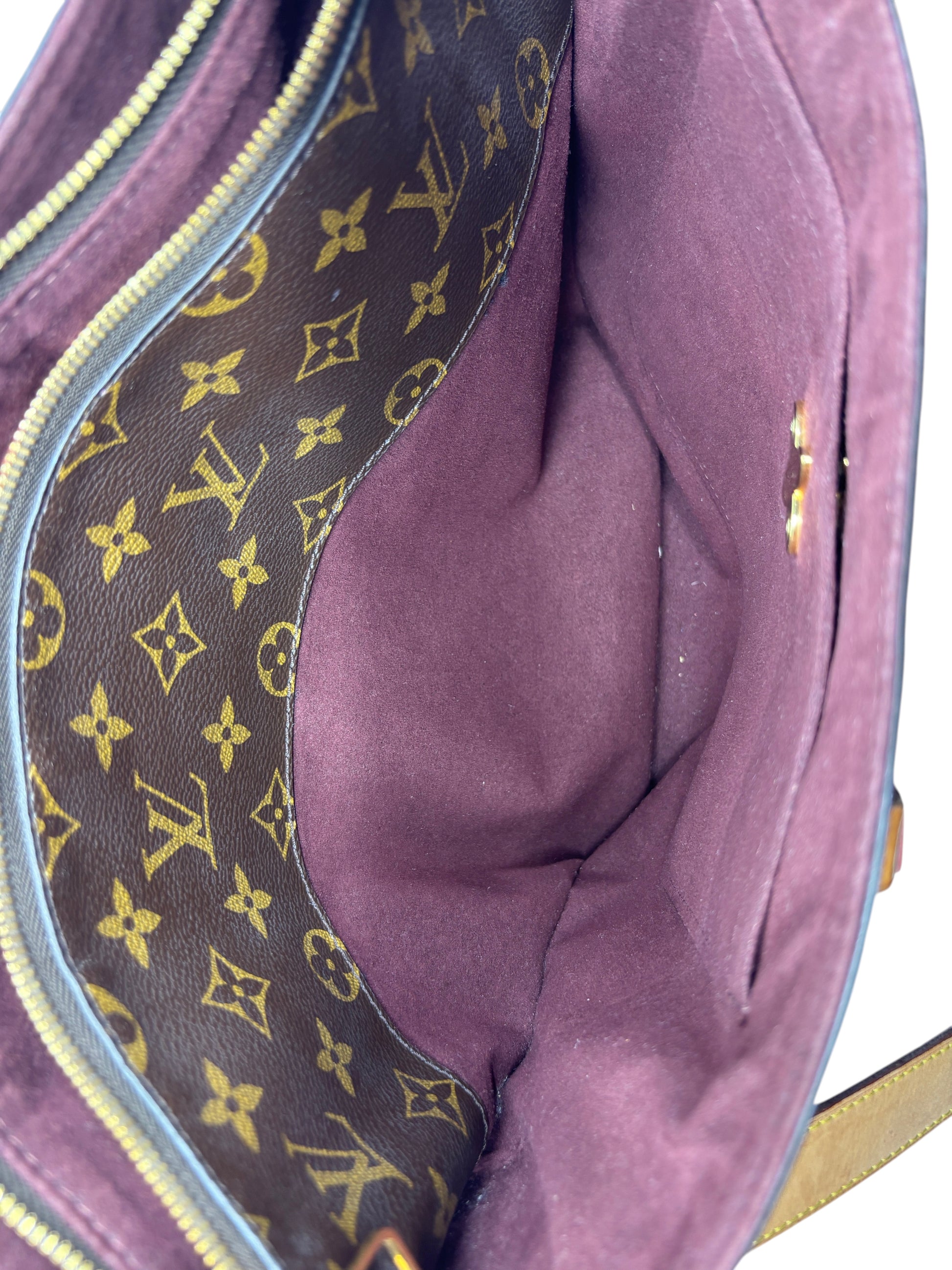 Interior of Posh Purse Co Louis Vuitton Flower Zipped Tote featuring brown Monogram canvas and deep purple lining