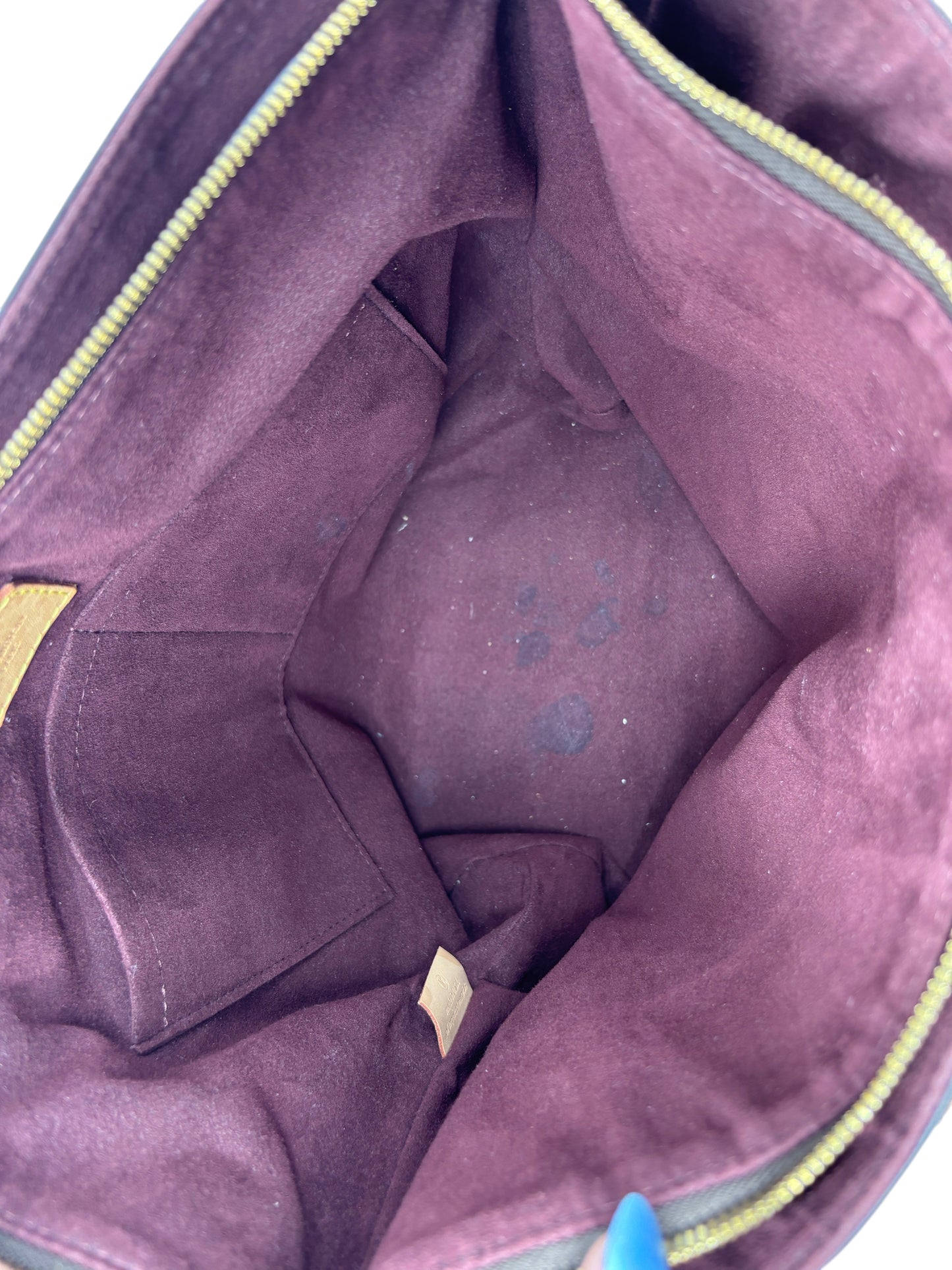 Interior of a Posh Purse Co. Louis Vuitton Flower Zipped Tote featuring deep purple lining and a secure zip closure.