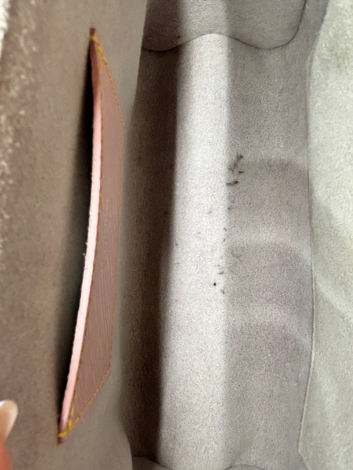 Interior of a Posh Purse Co preloved Louis Vuitton Epi Twist MM bag showing grey lining with visible pen marks