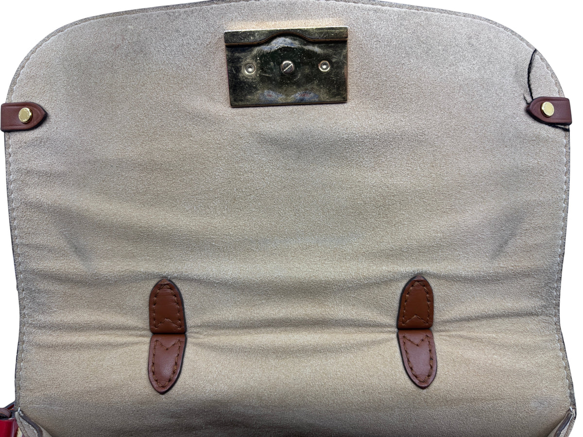 Interior flap of a Posh Purse Co Louis Vuitton Vaugirard bag featuring beige suede lining and gold-tone hardware.