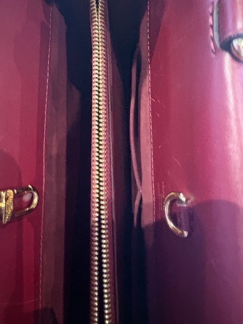 Posh Purse Co Louis Vuitton Venus tote bag in red leather with gold-tone hardware and top zip closure.