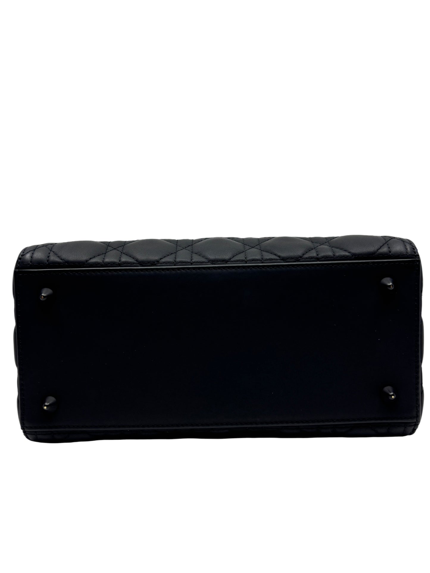 Posh Purse Co. matte black Lady Dior medium bag base view showing protective metal feet and cannage stitching