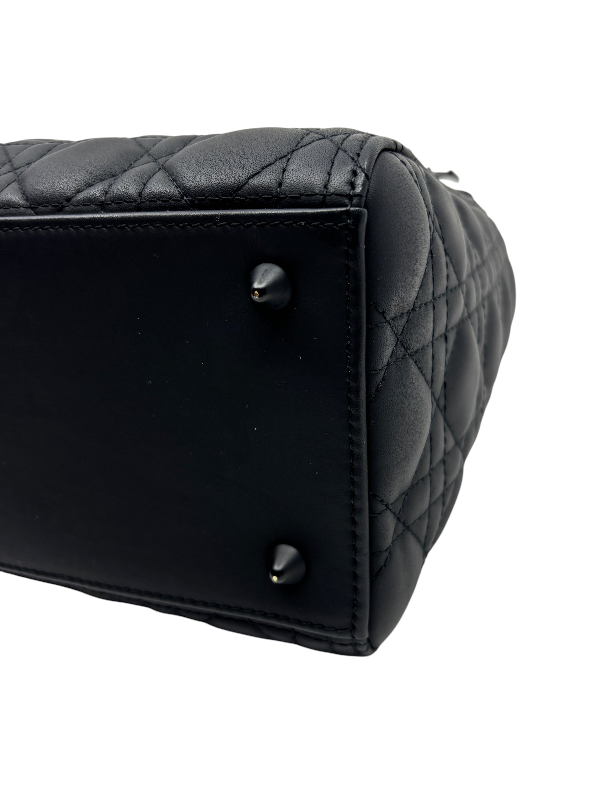 Posh Purse Co. matte black Lady Dior medium bag base with protective feet and signature cannage quilting.