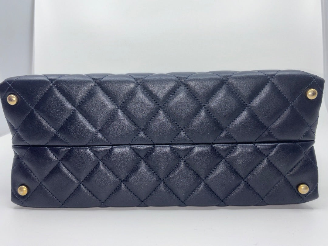 Posh Purse Co. navy blue quilted leather Chanel tote bag with gold hardware.