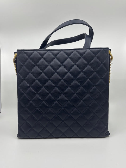 Posh Purse Co. navy blue quilted leather Chanel tote bag with gold hardware and top handles.
