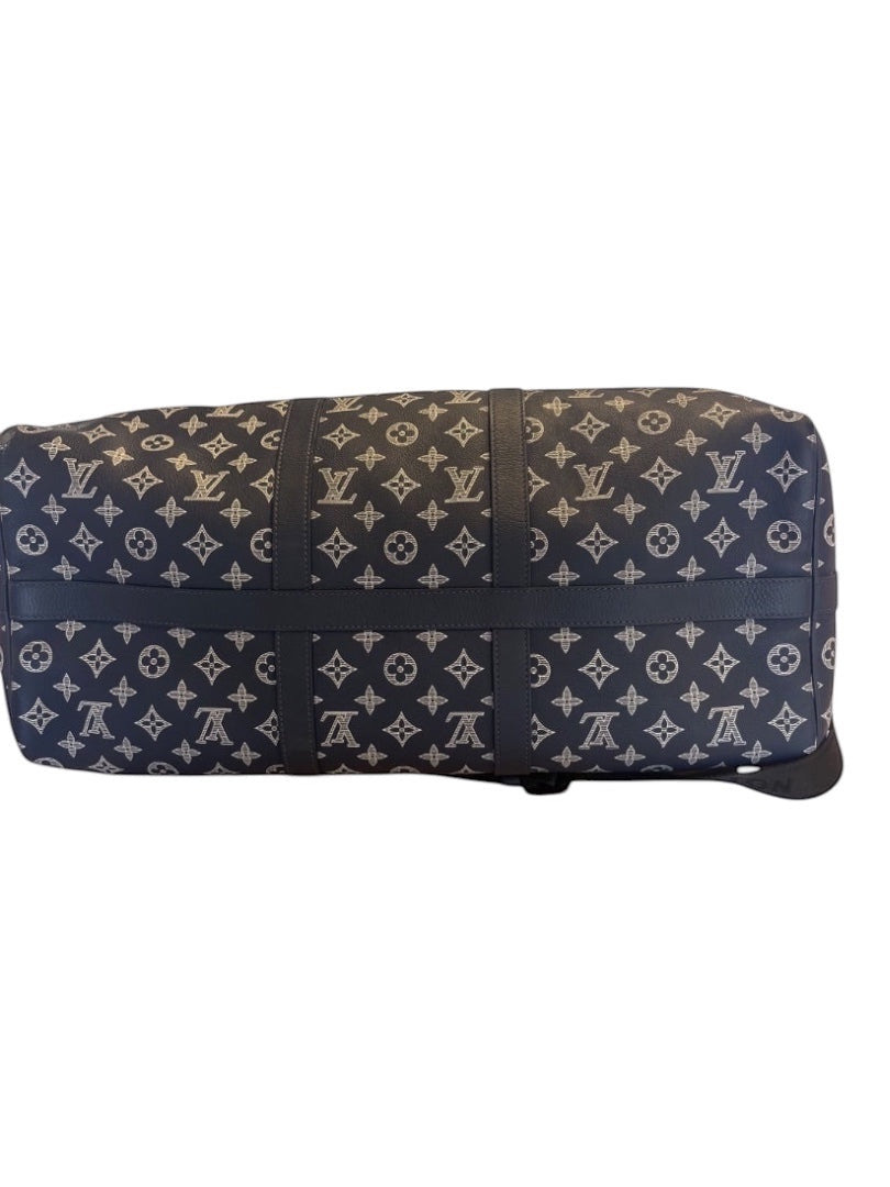 Posh Purse Co navy Louis Vuitton Monogram Shadow calfskin leather Keepall 50 travel bag with embossed pattern and rolled handles.