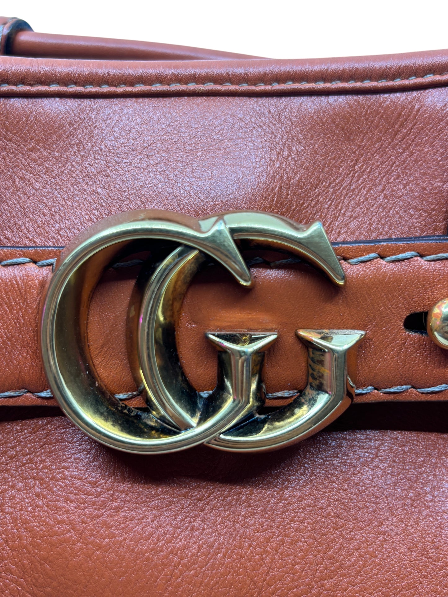 Posh Purse Co. orange leather Gucci GG Running tote bag featuring a gold-tone interlocking GG logo hardware detail.