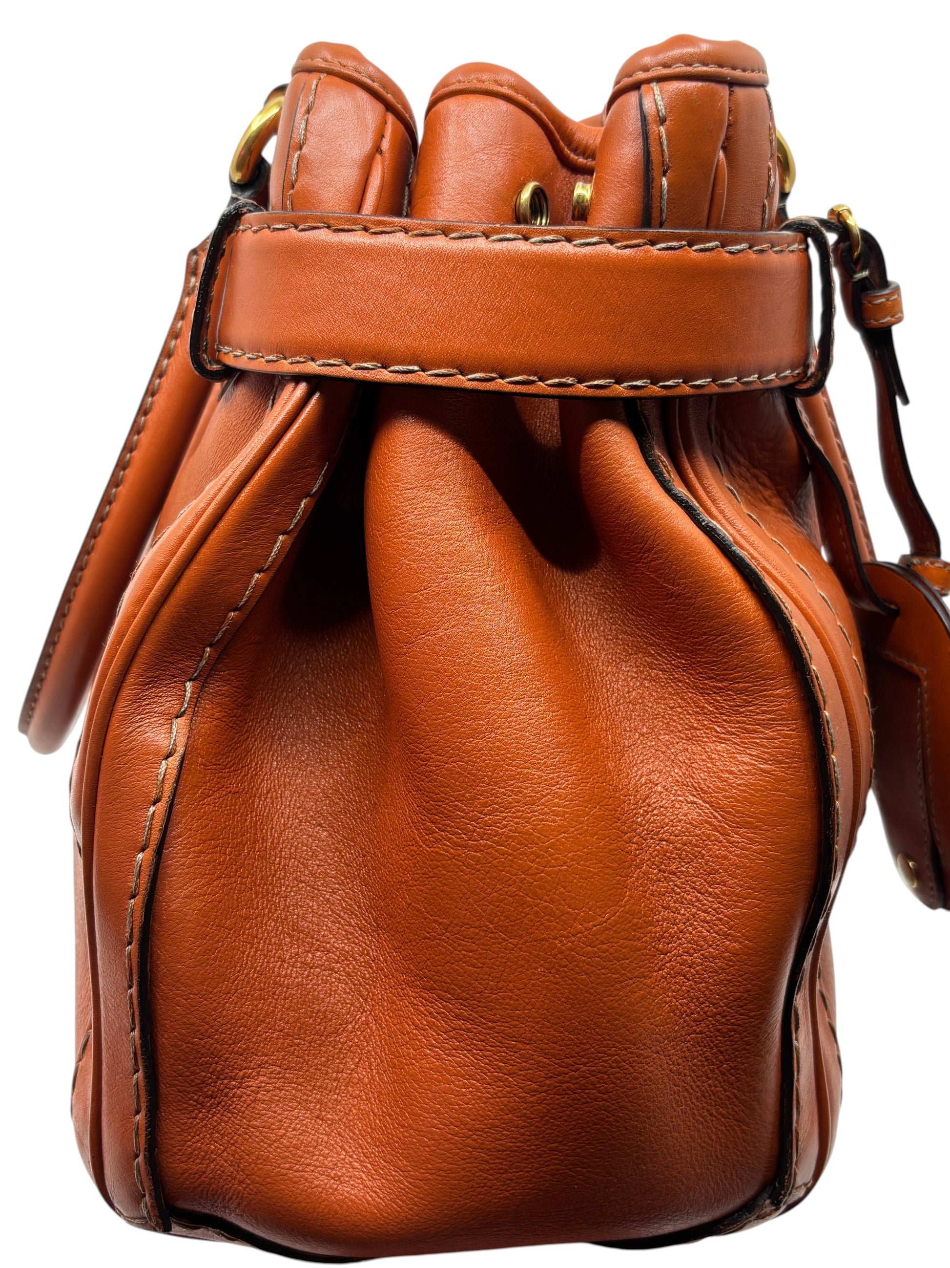 Posh Purse Co. preloved orange leather Gucci GG Running tote bag showing side profile and detailed stitching.