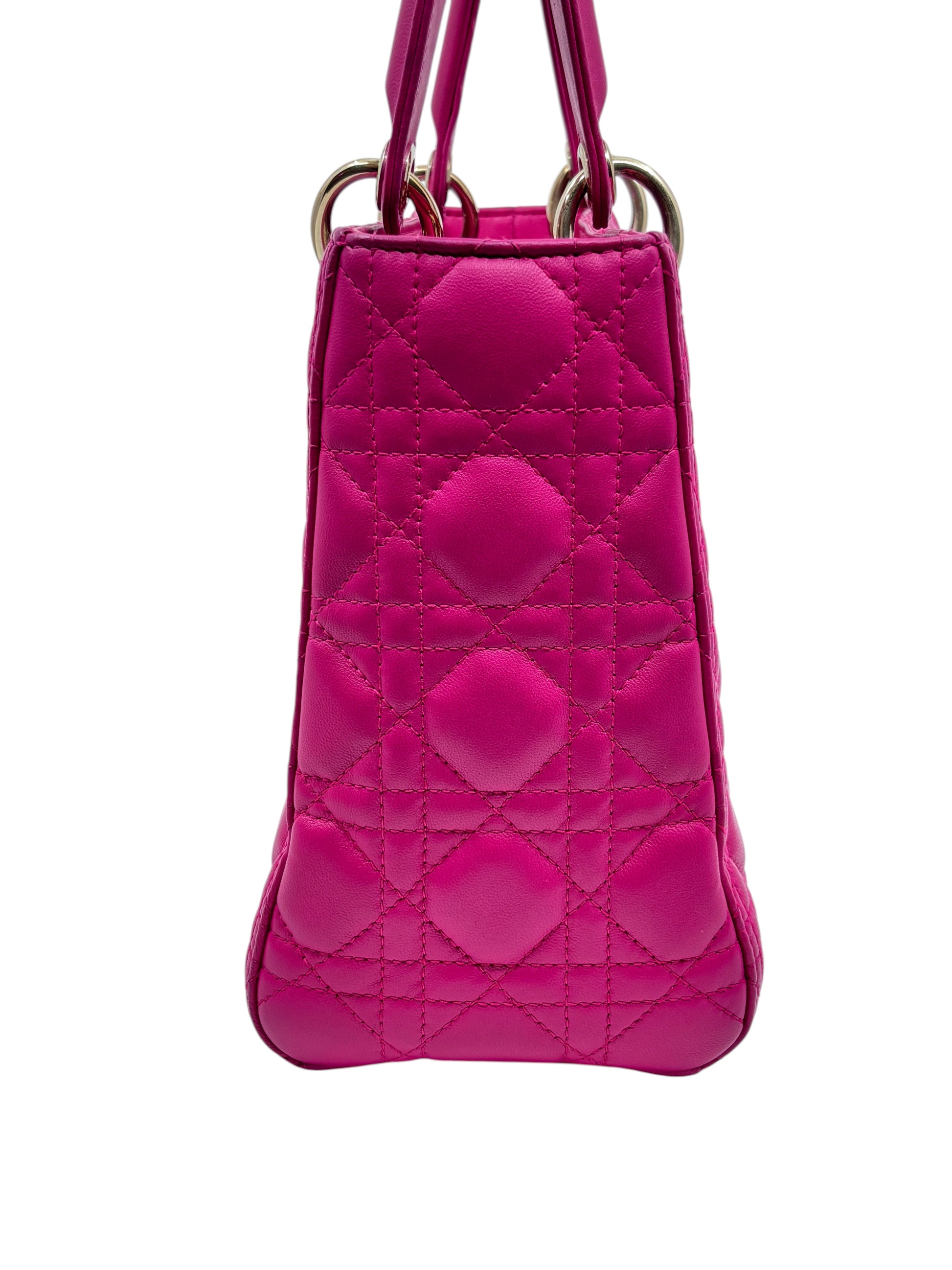 Side view of a pink medium Lady Dior bag with signature Cannage quilting from Posh Purse Co