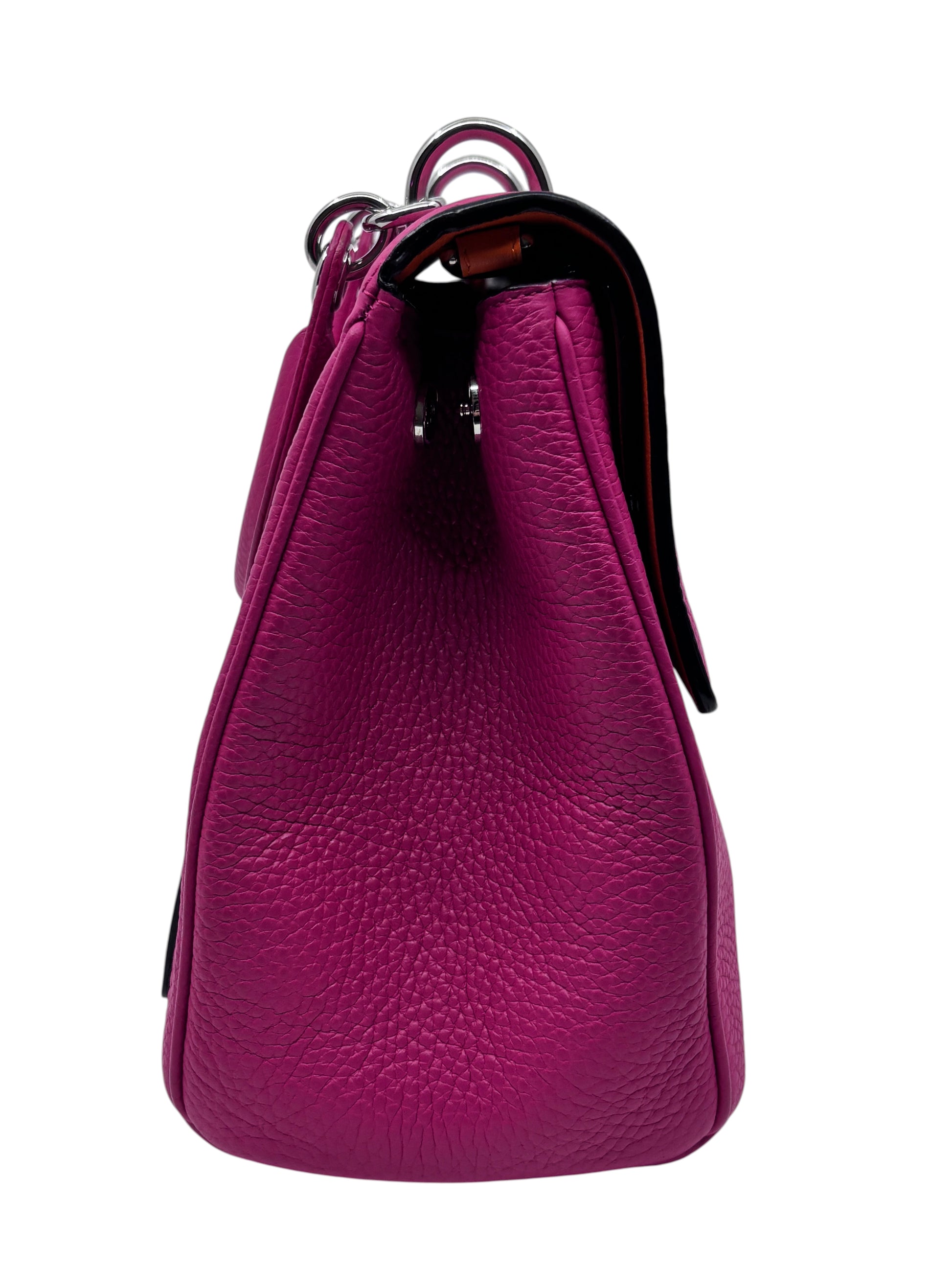 Side view of a pink pebbled leather Christian Dior Be Dior bag with polished hardware from Posh Purse Co.