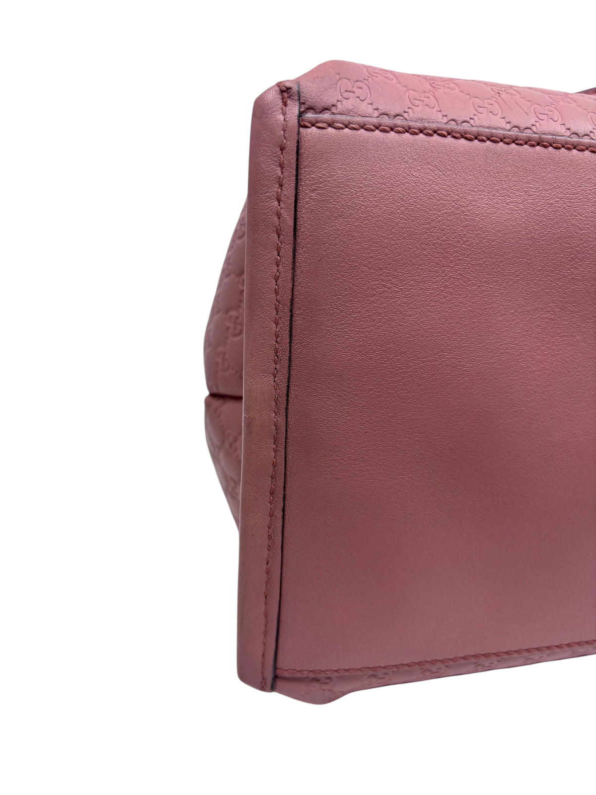 Posh Purse Co pink Gucci Micro Guccissima leather handbag side panel detail showing embossed monogram texture