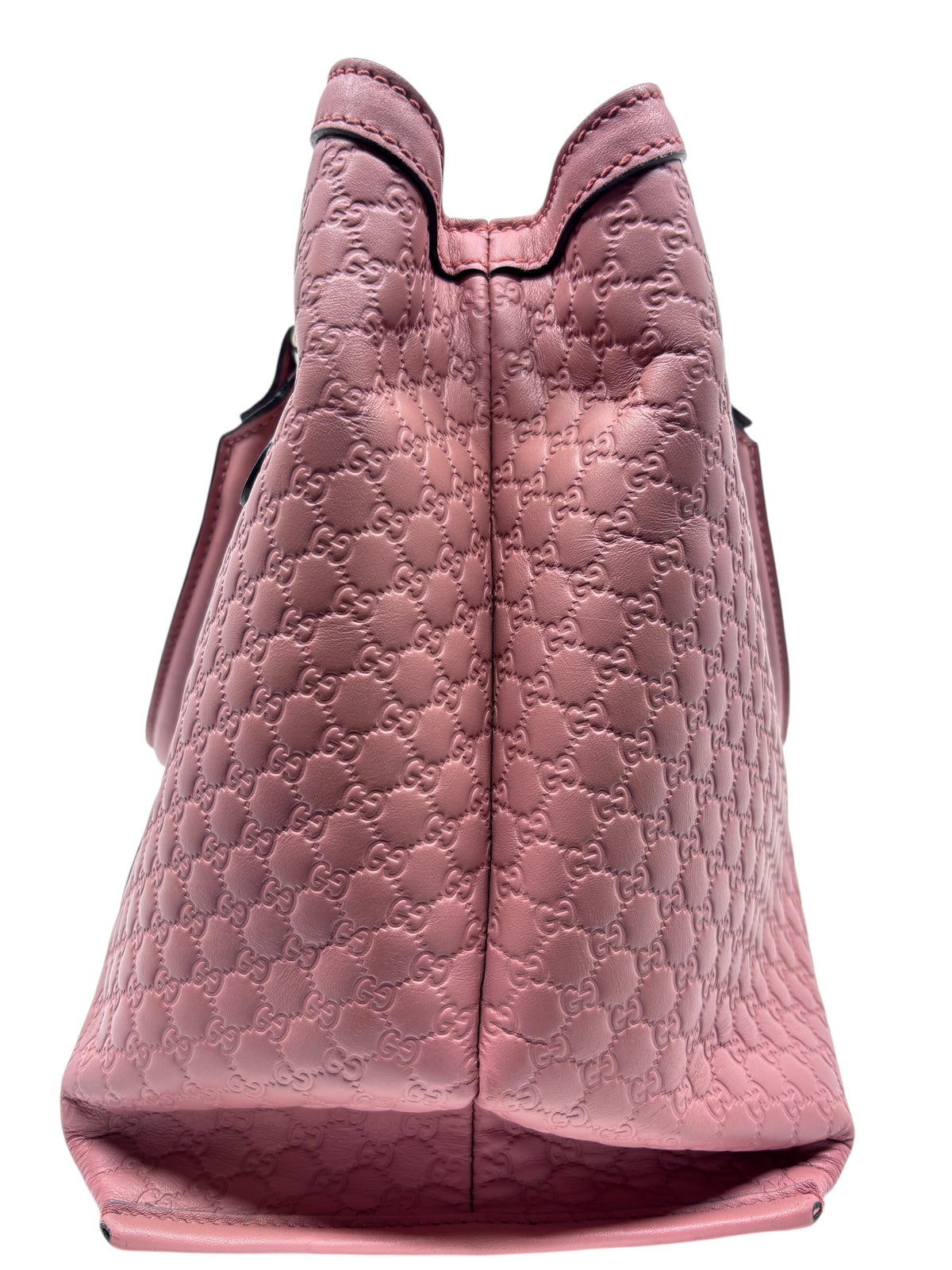 Posh Purse Co pink Gucci Micro Guccissima embossed leather handbag side view showing structured silhouette