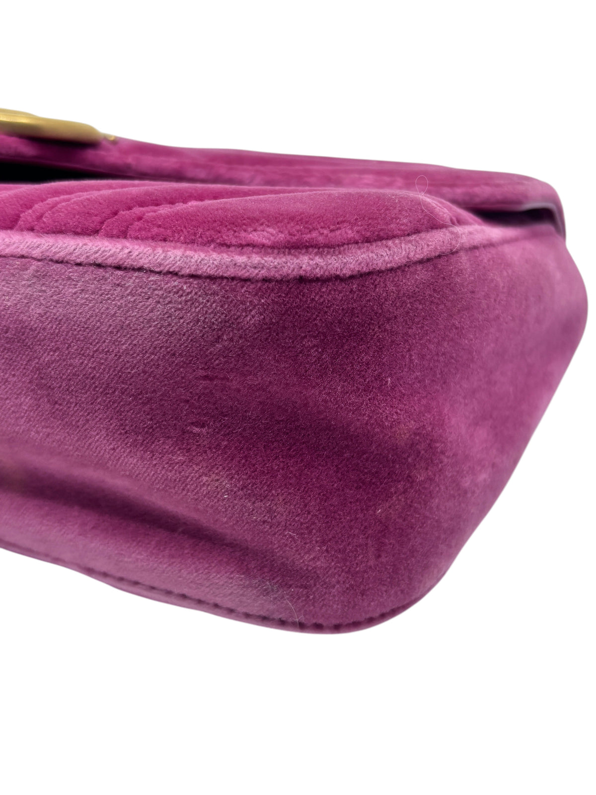 Close-up of the pink velvet exterior of a preloved Posh Purse Co Gucci Marmont shoulder bag showing soft texture.