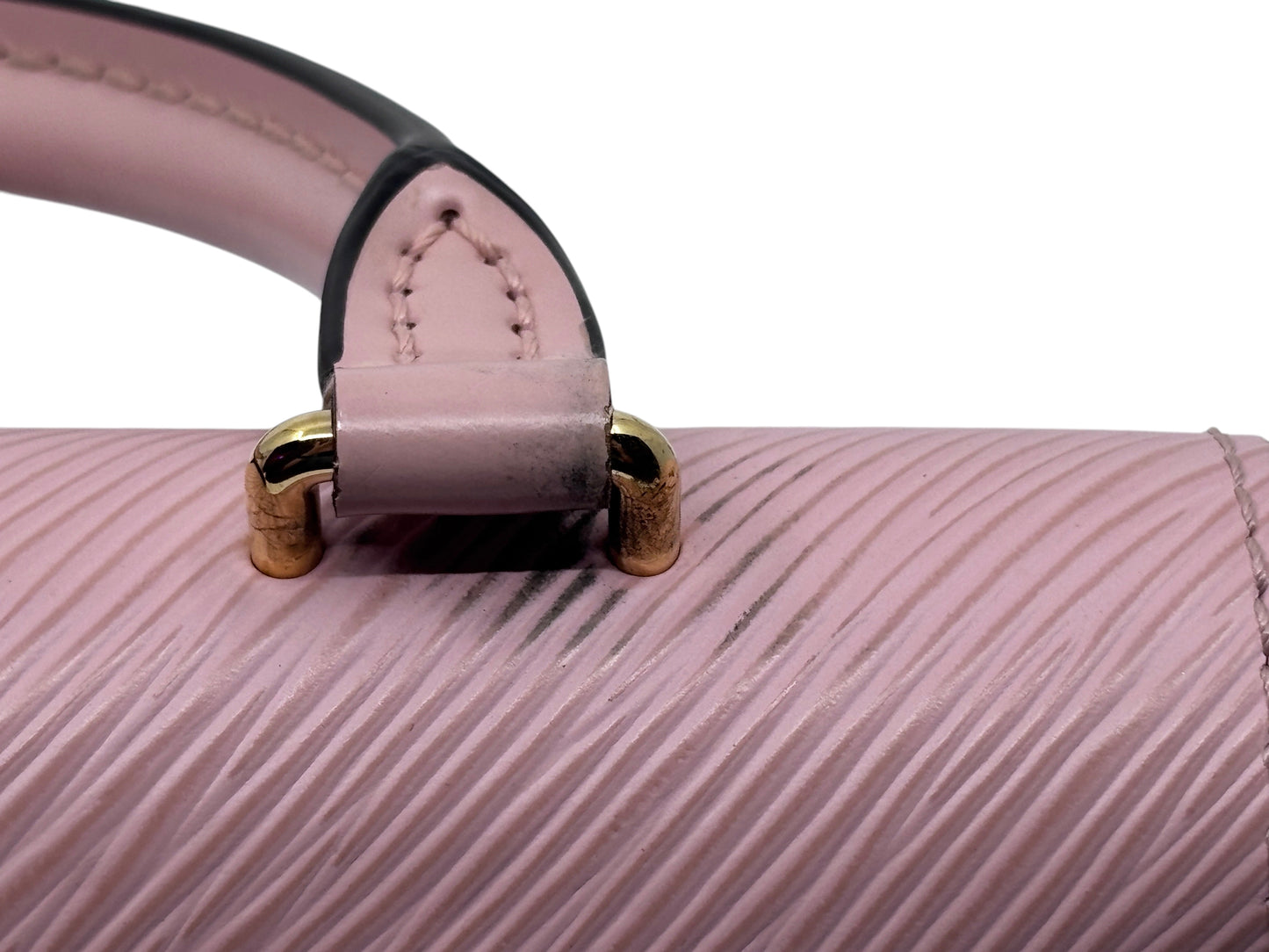 Posh Purse Co. pink Louis Vuitton Locky handbag showing close-up of handle attachment and textured leather detail