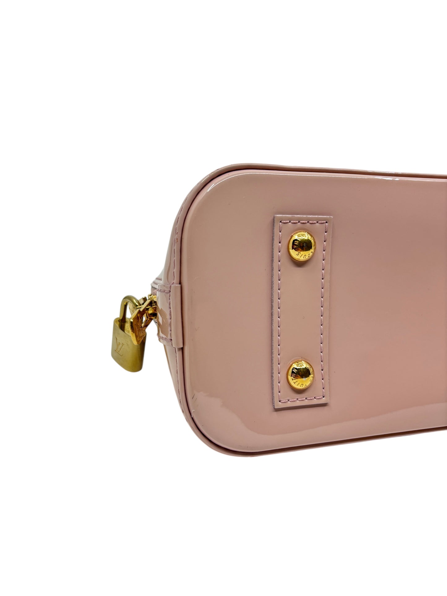 Posh Purse Co pink Louis Vuitton Vernis Alma BB handbag side view showing gold hardware and protective base studs