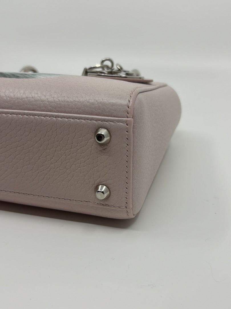 Posh Purse Co. preloved pink leather Mini Lady Dior bag featuring silver protective feet and signature charms.