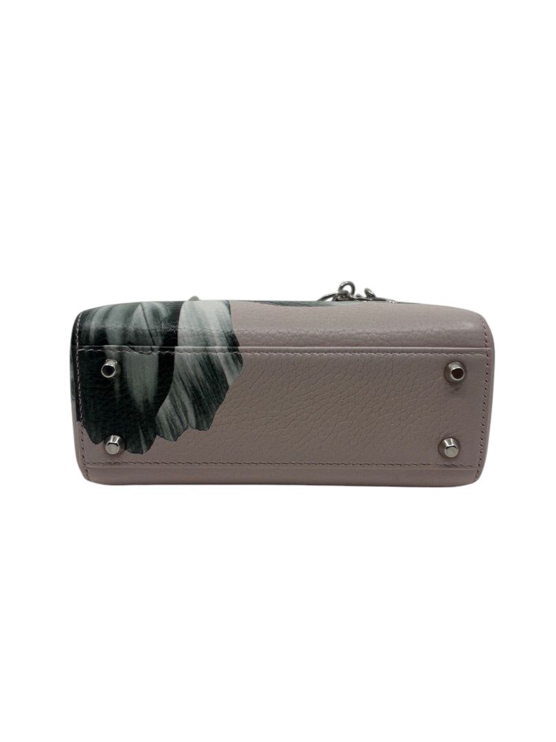 Base of a pink Dior Mini Lady Dior bag with floral print and silver protective feet, available at Posh Purse Co.