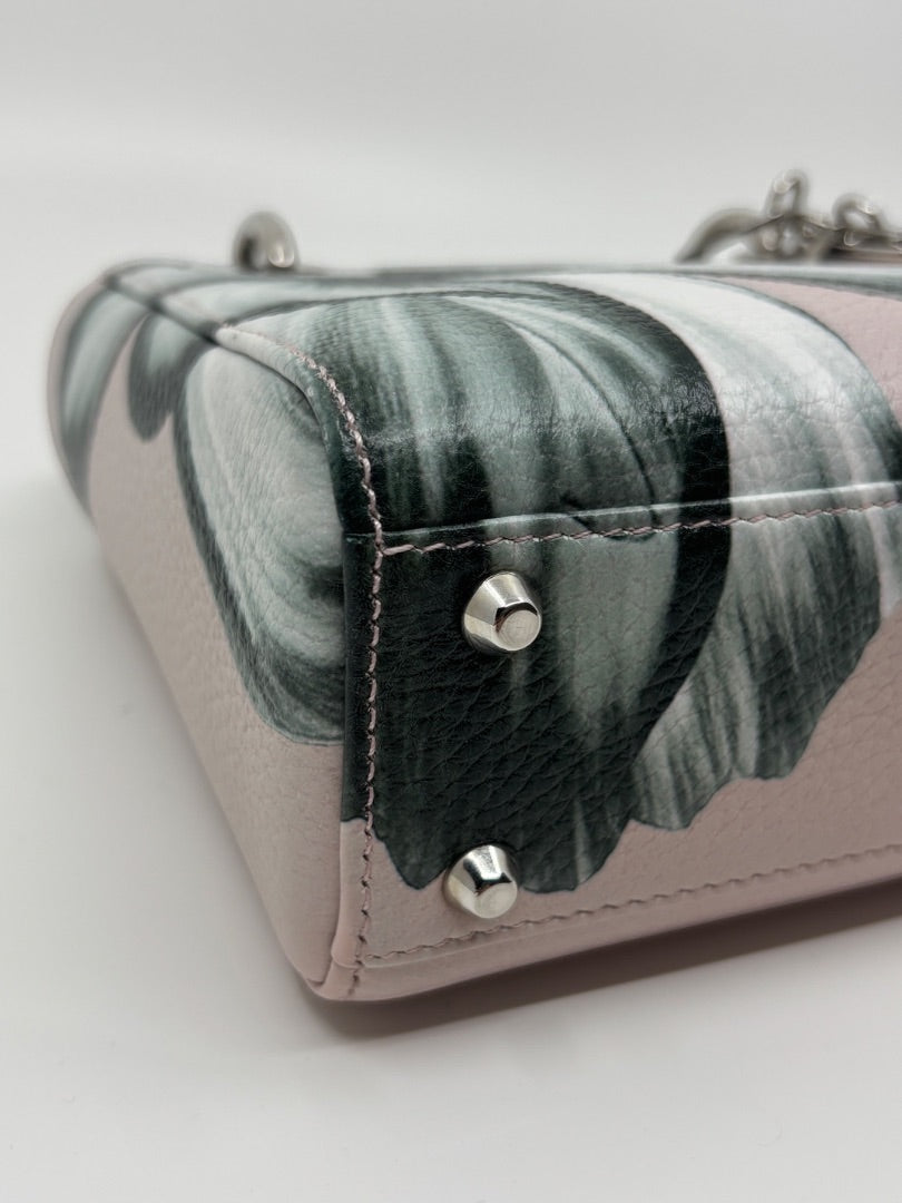 Posh Purse Co. preloved pink Mini Lady Dior bag with floral print, leather texture, and silver protective feet.