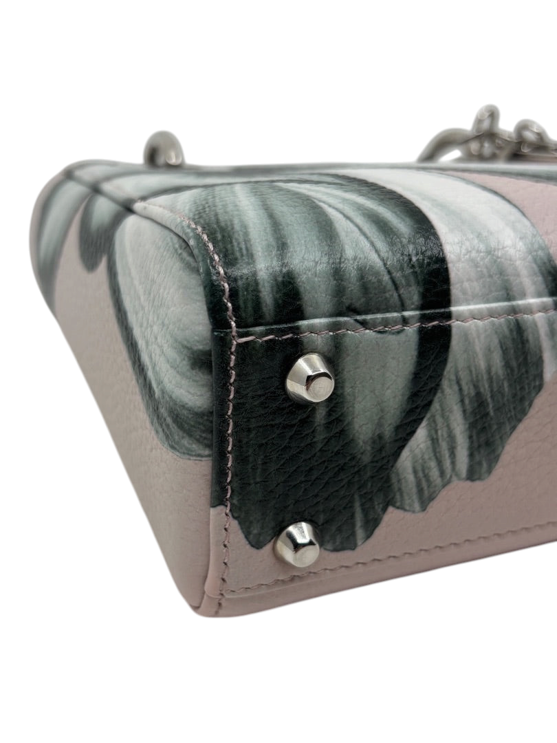 Posh Purse Co. preloved pink Mini Lady Dior bag with floral print, leather texture, and silver protective feet.