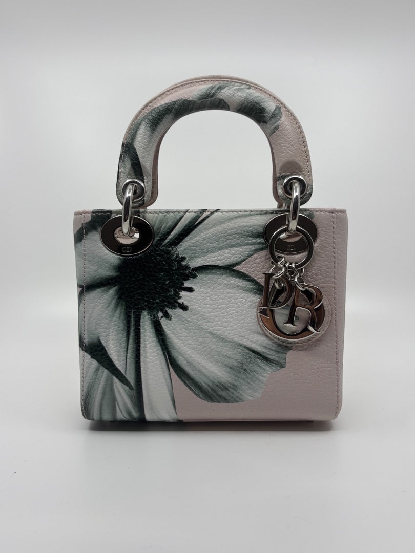 Posh Purse Co. preloved pink Mini Lady Dior bag with floral print, silver hardware, and signature Dior letter charms.