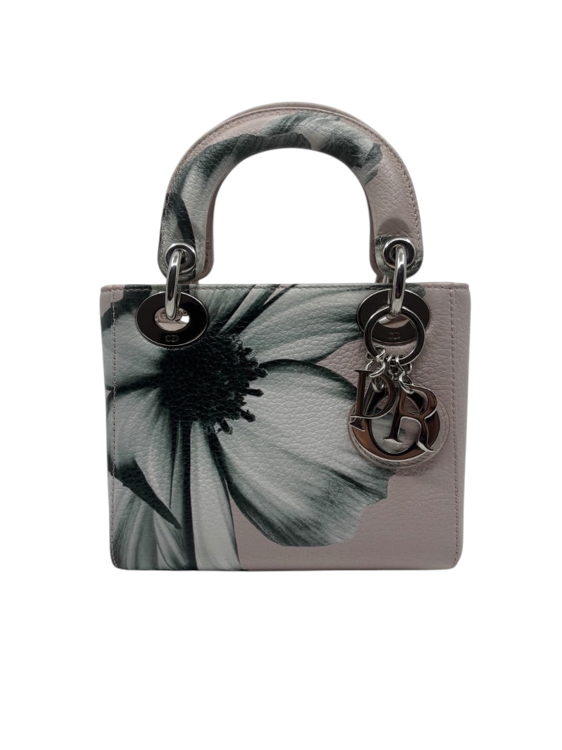 Posh Purse Co. preloved pink Mini Lady Dior bag with floral print, silver hardware, and signature Dior letter charms.
