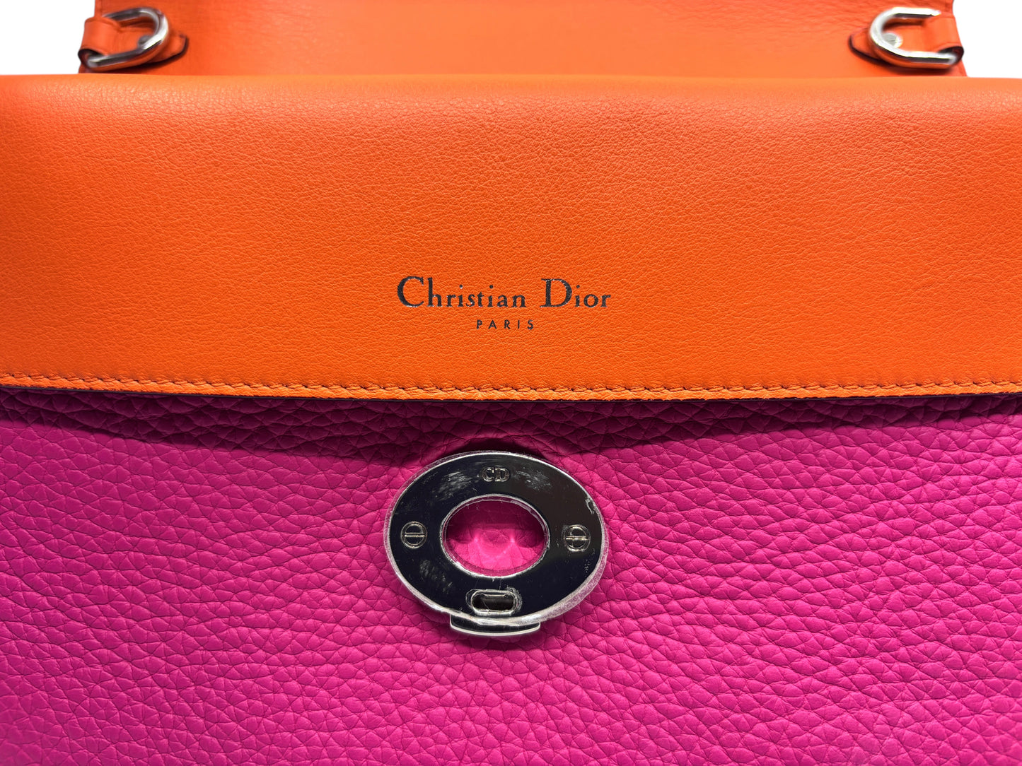 Posh Purse Co. Christian Dior Be Dior leather handbag in vibrant pink and orange with silver hardware detail.