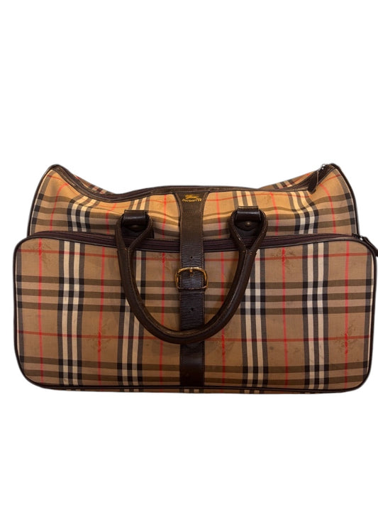 Posh Purse Co. classic plaid duffle bag with dark brown leather handles and trim. Beige, black, red, and white plaid pattern.