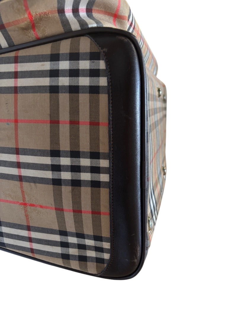 Posh Purse Co. Classic Plaid Weekend Duffle Bag in beige, black, red, and white plaid with dark brown leather trim.