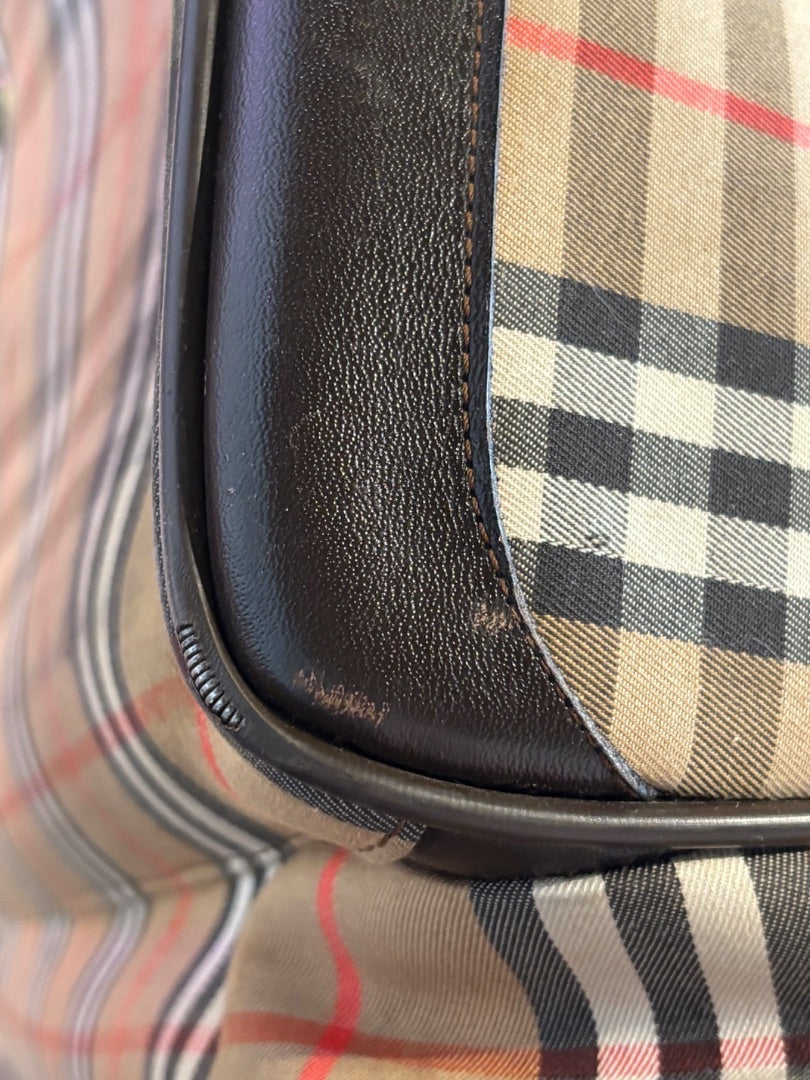 Posh Purse Co. Classic Plaid Weekend Duffle Bag in beige, black, red, and white plaid with dark brown leather trim and handles.