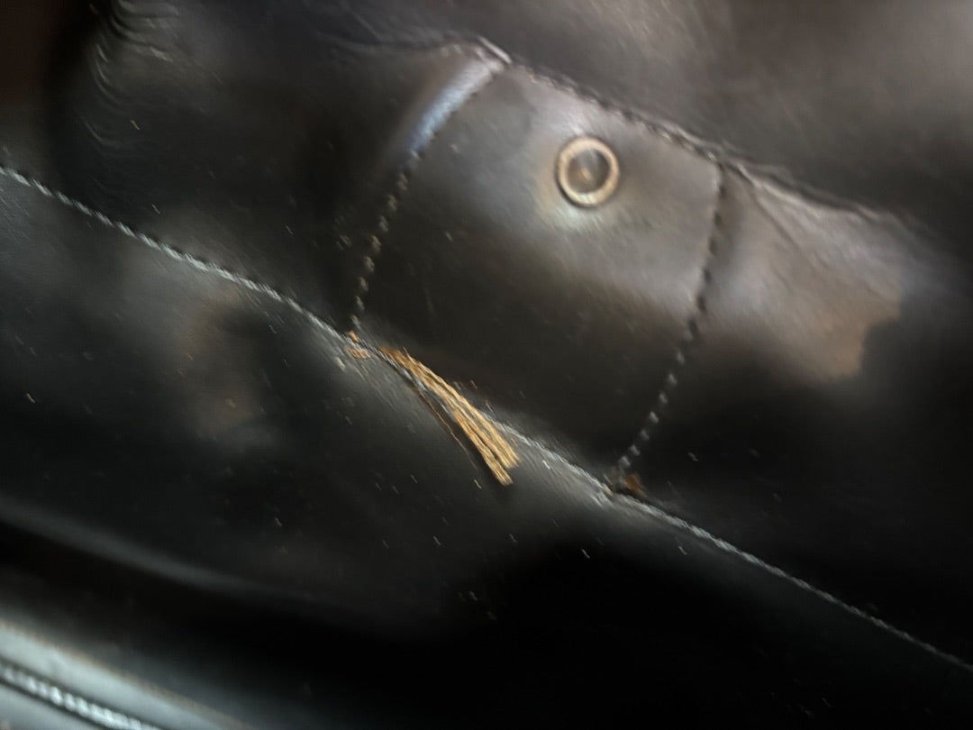Posh Purse Co. Classic Plaid Weekend Duffle Bag interior detail, black faux leather with stitching and hardware.