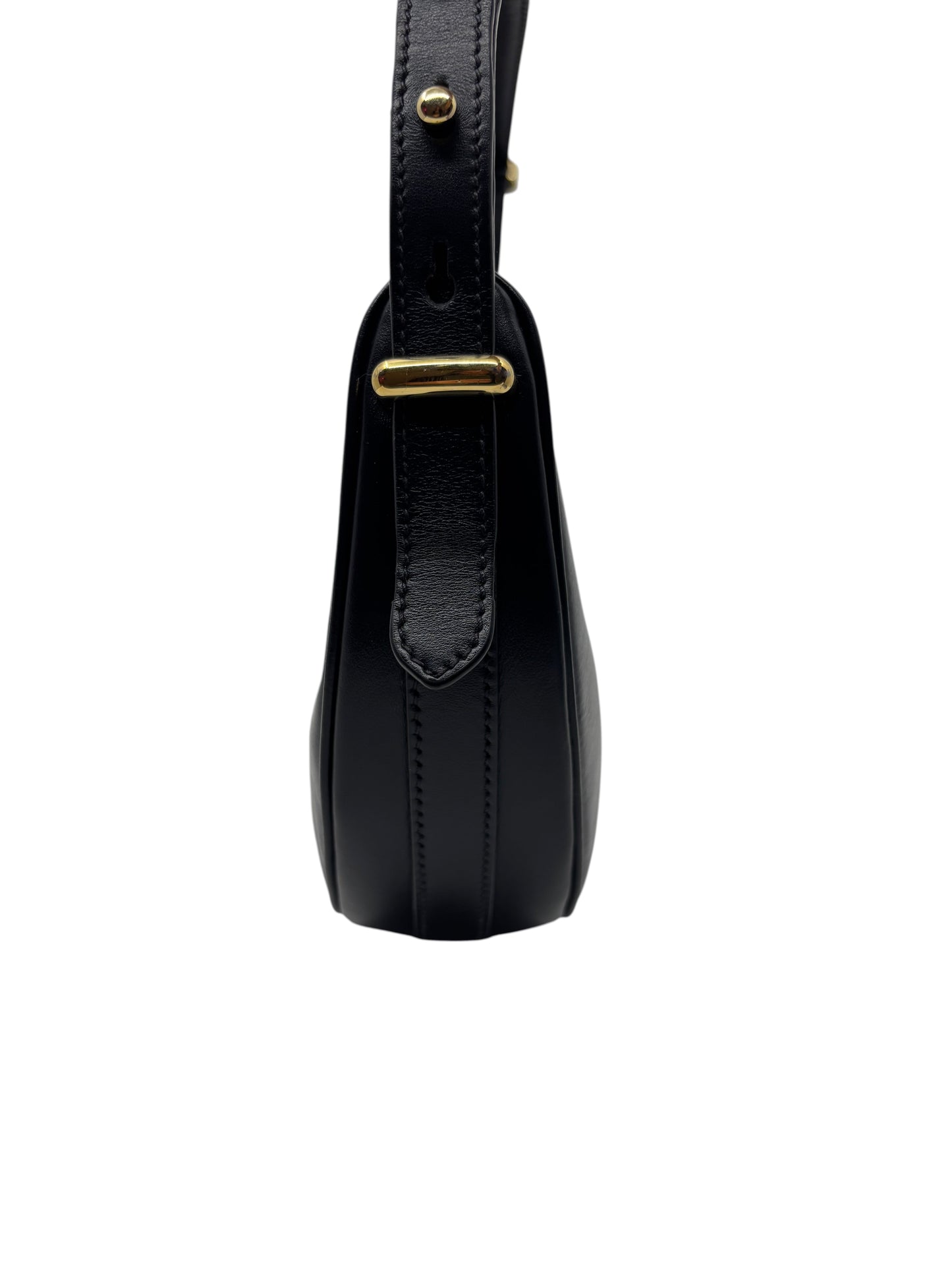 Side view of a black leather Posh Purse Co. Prada Arque shoulder bag featuring gold-tone hardware and curved edges.