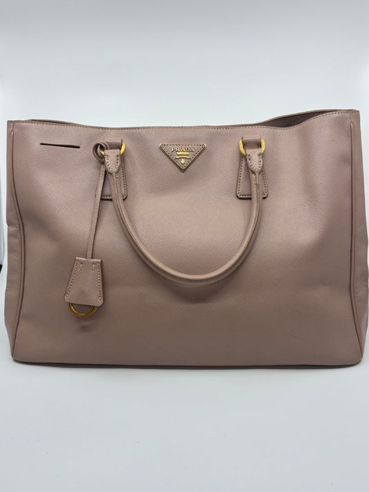 Posh Purse Co. large blush pink Saffiano leather Prada tote bag with gold hardware and signature triangle logo.