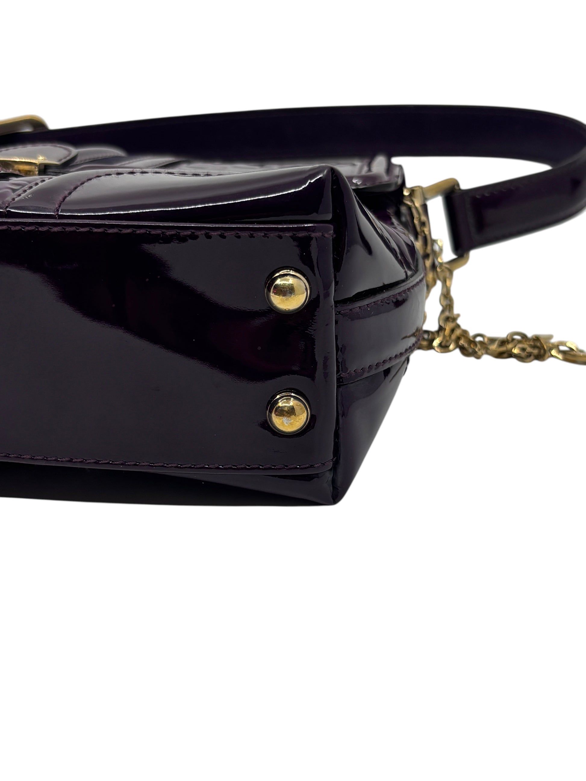Posh Purse Co purple patent leather Gucci Horsebit Treasure Bag featuring gold-tone metal feet and chain detail.